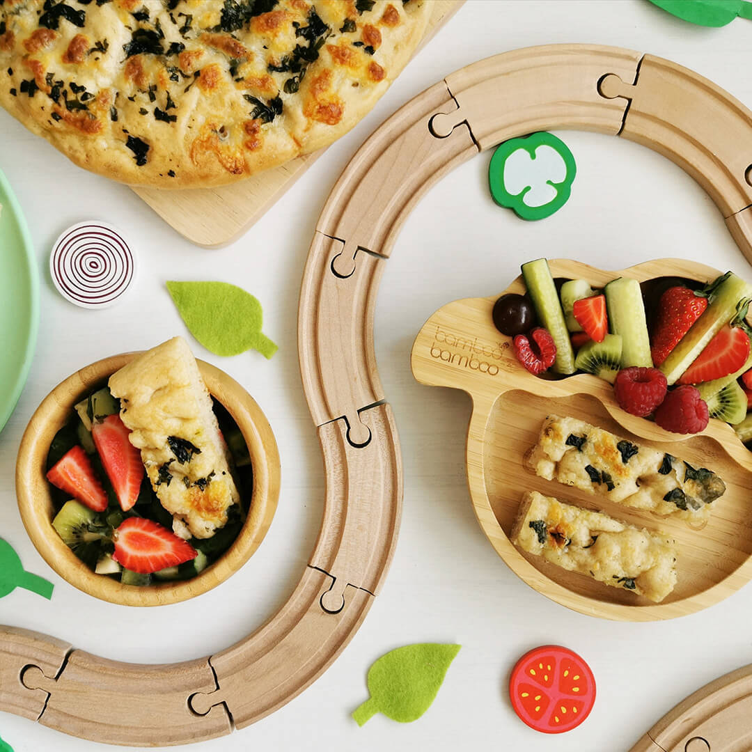 Mozzarella & Basil Focaccia served with cucumber, strawberries, kiwi and raspberries